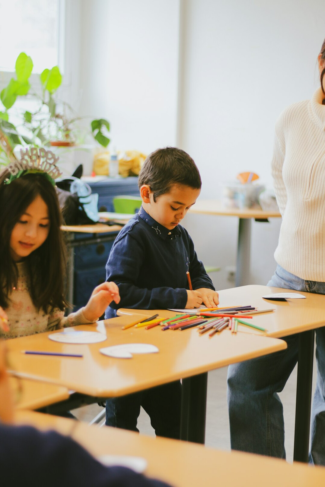 teacher helping students with math