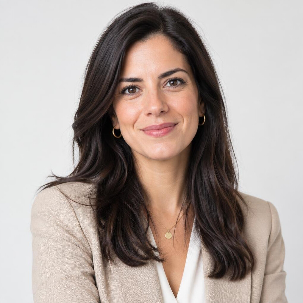 Portrait of a Portuguese woman journalist smiling in an office
